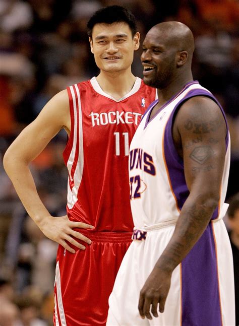 yao ming height in feet and weight